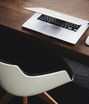 The hand rail is going a little faster than the moving sidewalk.